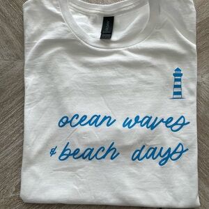 White T-Shirt with Blue Ocean Waves Print & lighthouse
